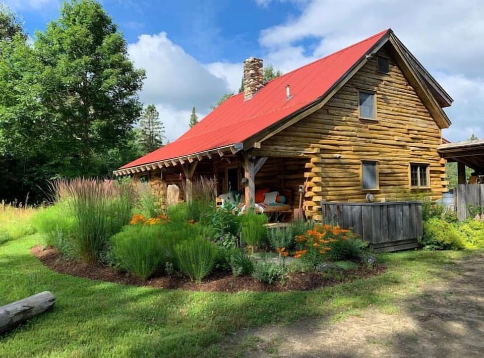 Lush perennial gardens surround the cabin in summer. Hummingbirds abound!