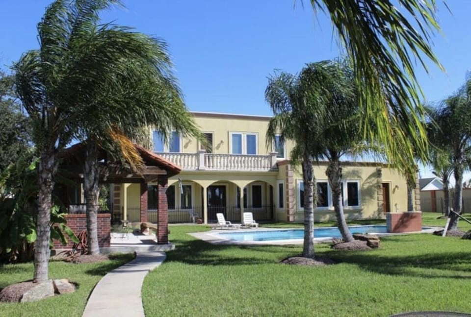 Rear view of the Villa from the private lake (note: 2nd floor palapa added)!
