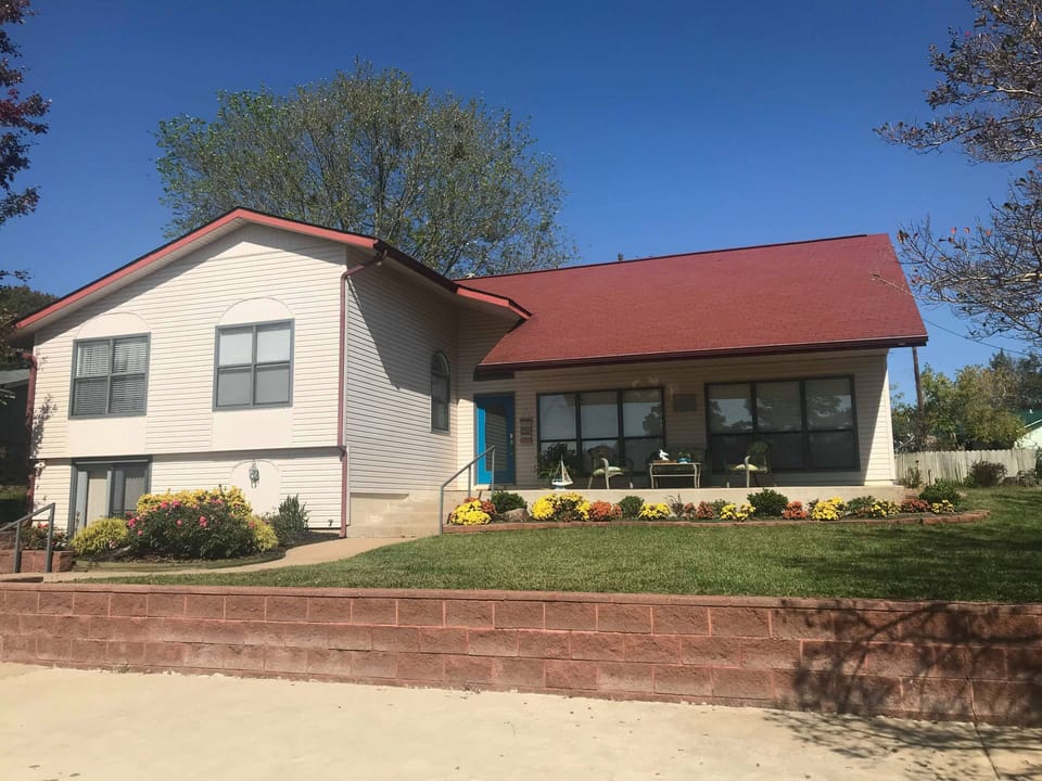 Front of home and parking area, there is additional parking in the driveway  