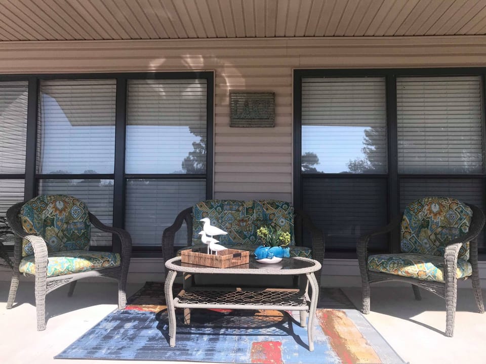 The front porch faces west with a beautiful view of the lake and sunsets