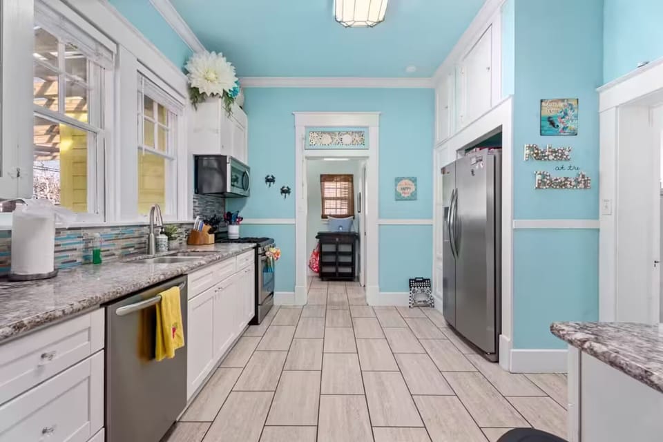 The kitchen looking into the laundry room. The powder room is just inside there