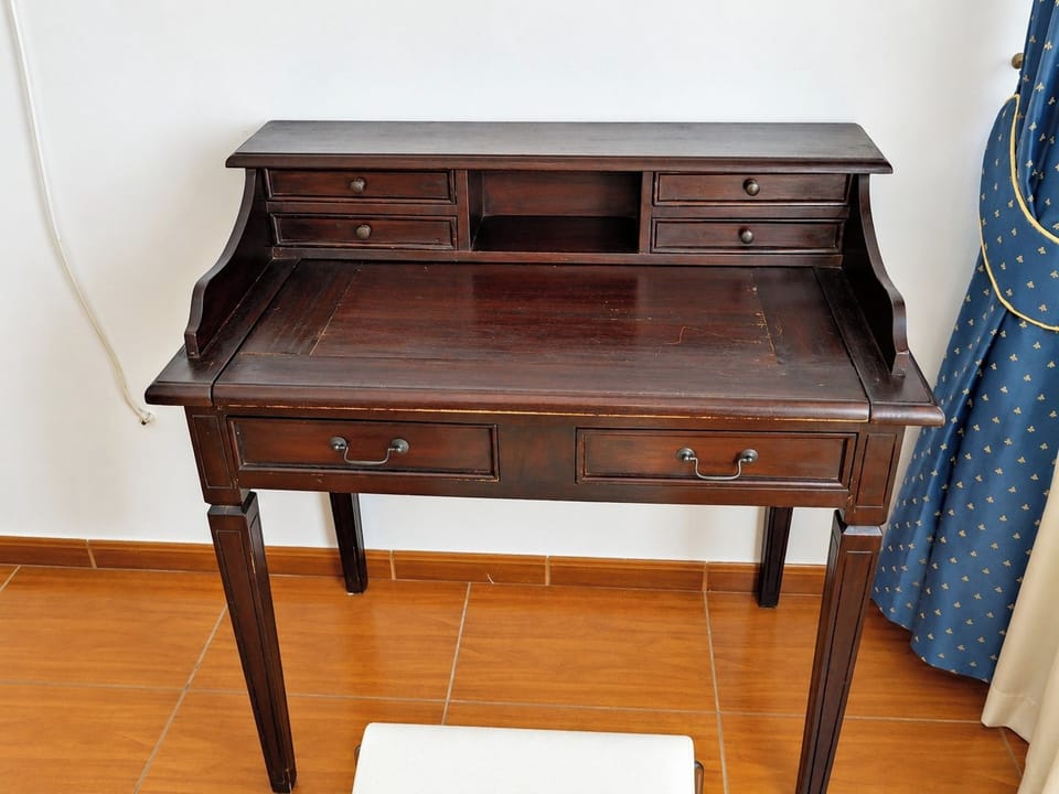 Classic writing desk in a quiet corner of the home.