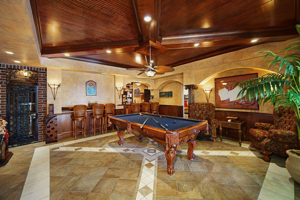 Next to the bar is a pool table & wine cellar with views of the pool (ground floor)