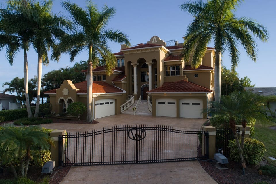 A three-car garage and gated driveway makes you feel like royalty
