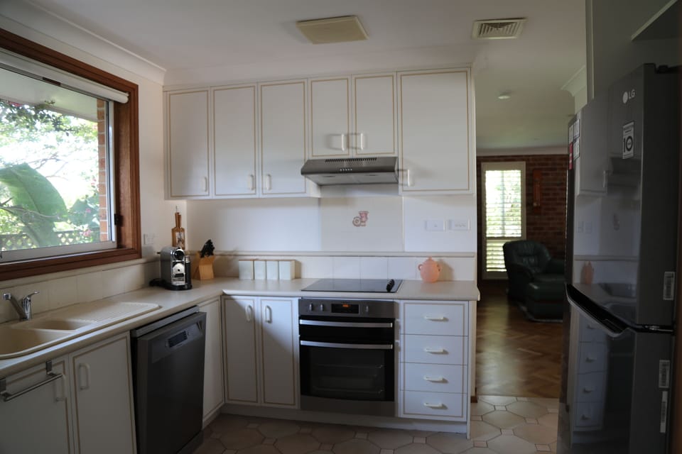 The kitchen features electric oven with grill,ceramic cook top plus dishwasher.