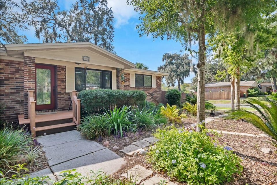 Inviting front walk and manicured flower beds create a warm and welcoming entry.