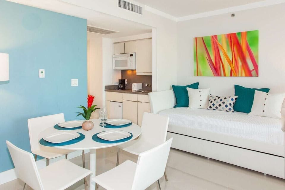 Studio: dining table with kitchenette. It includes 1 king and 2 twin-size beds.