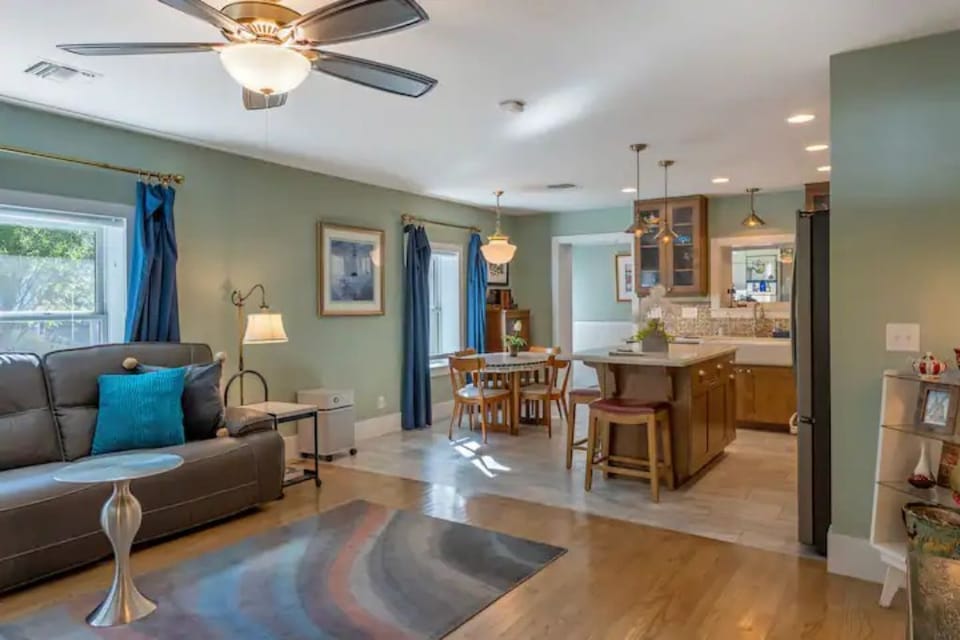 View of living, dining, and kitchen from front entrance 