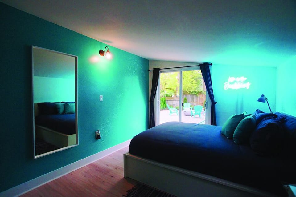 Master Bedroom with Queen Size Bed and direct access to outside patio area. 