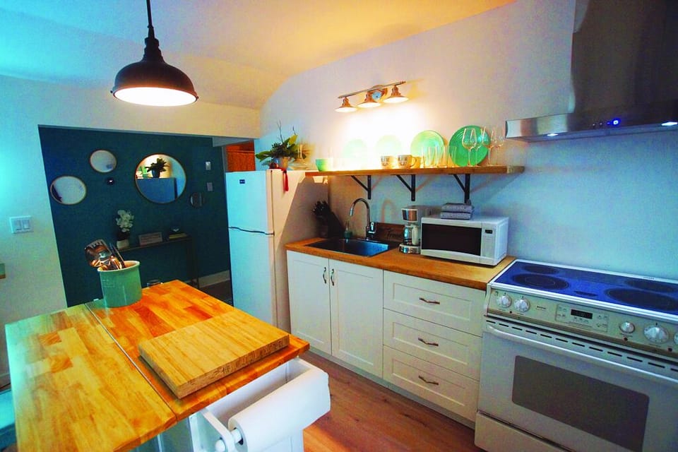 Full kitchen with all amenities, including coffee, tea, microwave, toaster...