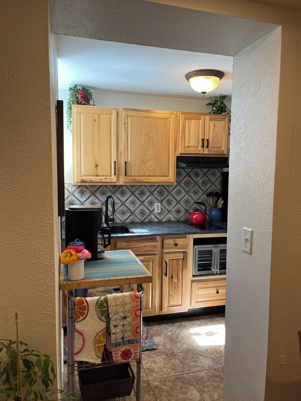 Living room leads to SMALL KITCHENETTE. NO Conventional Oven. Air fryer w/stove