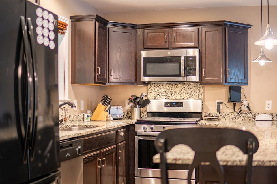 Enjoy cooking in our well-lit kitchen, with granite counter seating and all the tools you need to create memorable meals.