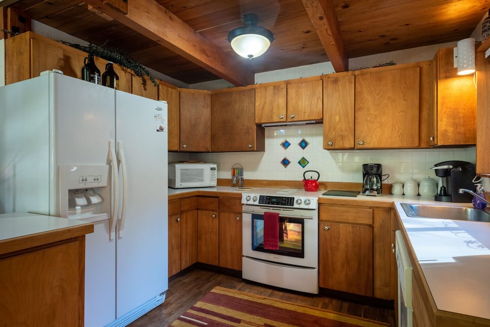 Kitchen - Kitchen, complete with microwave, refrigerator, oven, and dishwasher.