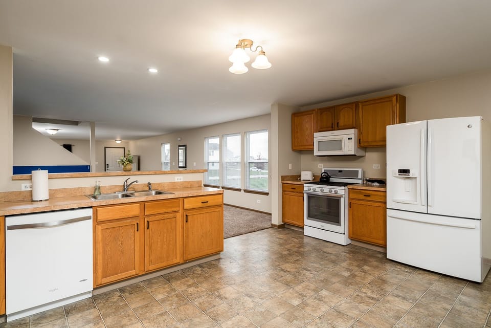 large kitchen with basic kitchen supplies