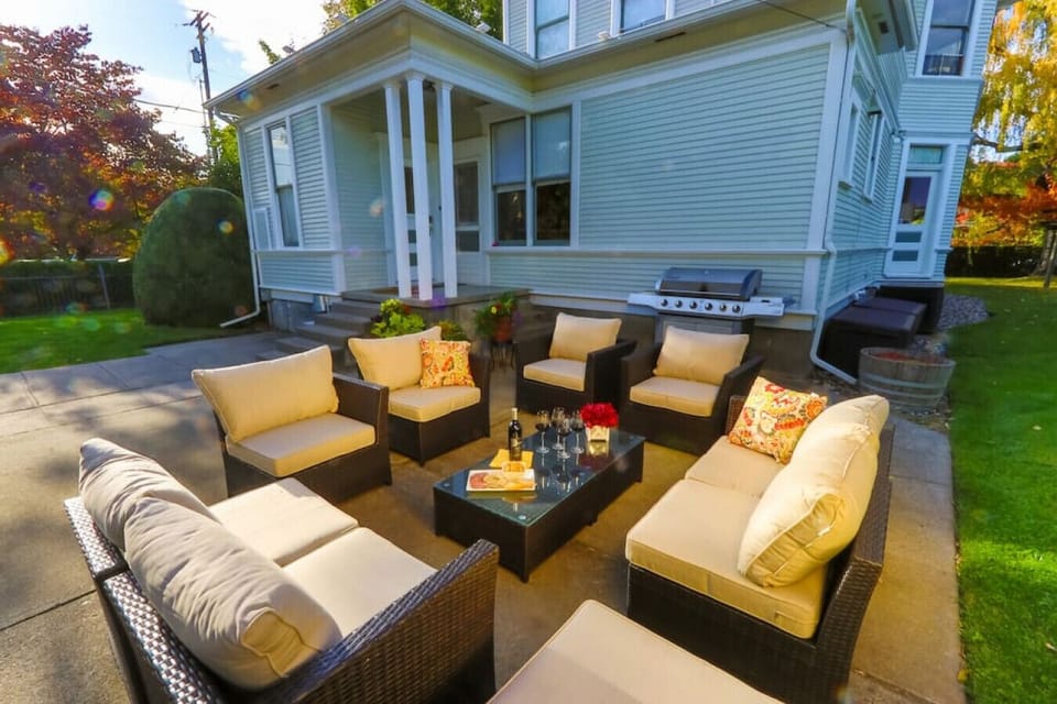 Enjoy wine together on the comfy back patio lounge chairs