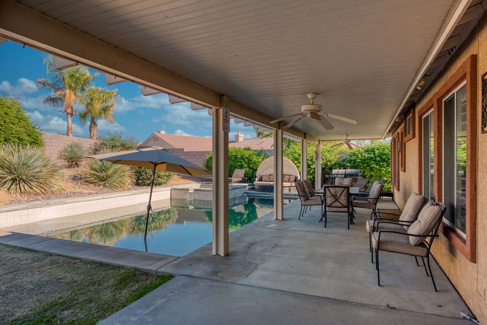 Outdoor covered patio with seating for eight