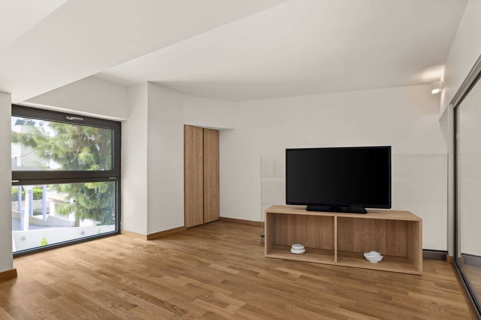 Mezzanine Featuring a Designated Television Area with City Views.