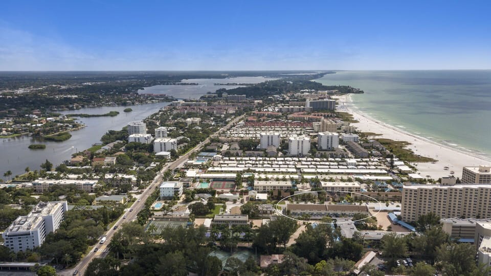 Wide aerial view of the Siesta Key coastline and Gulf waters