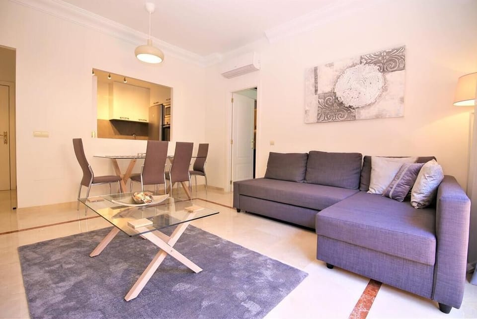 View of the spacious lounge with sofa bed and dining area to the rear