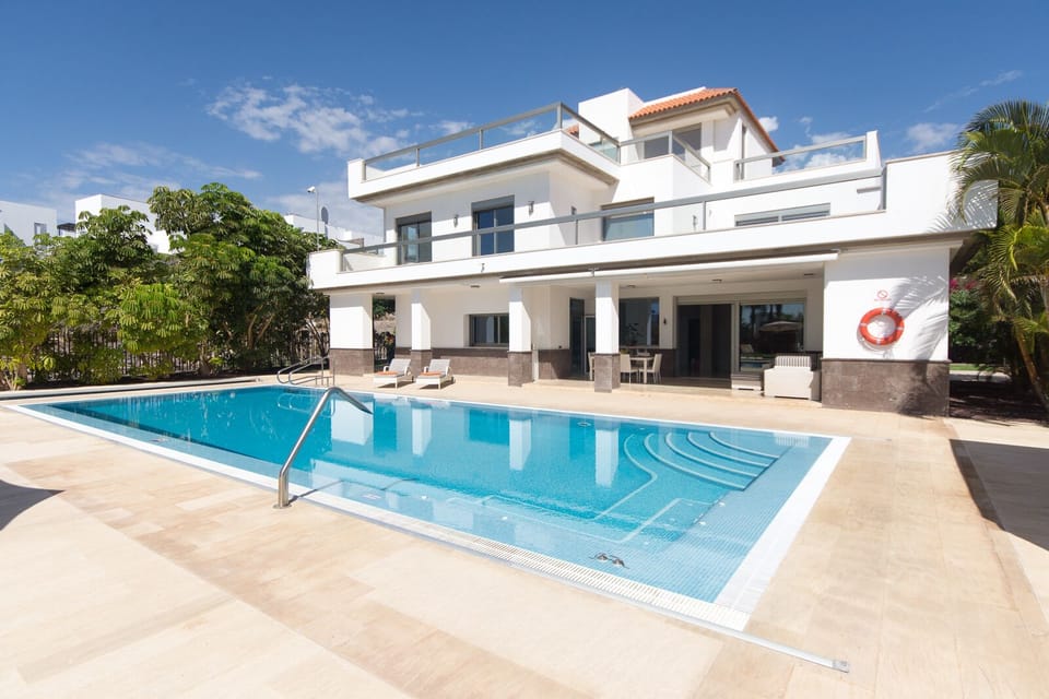 View of pool, villa and terrace. Villa has 12 loungers for your use