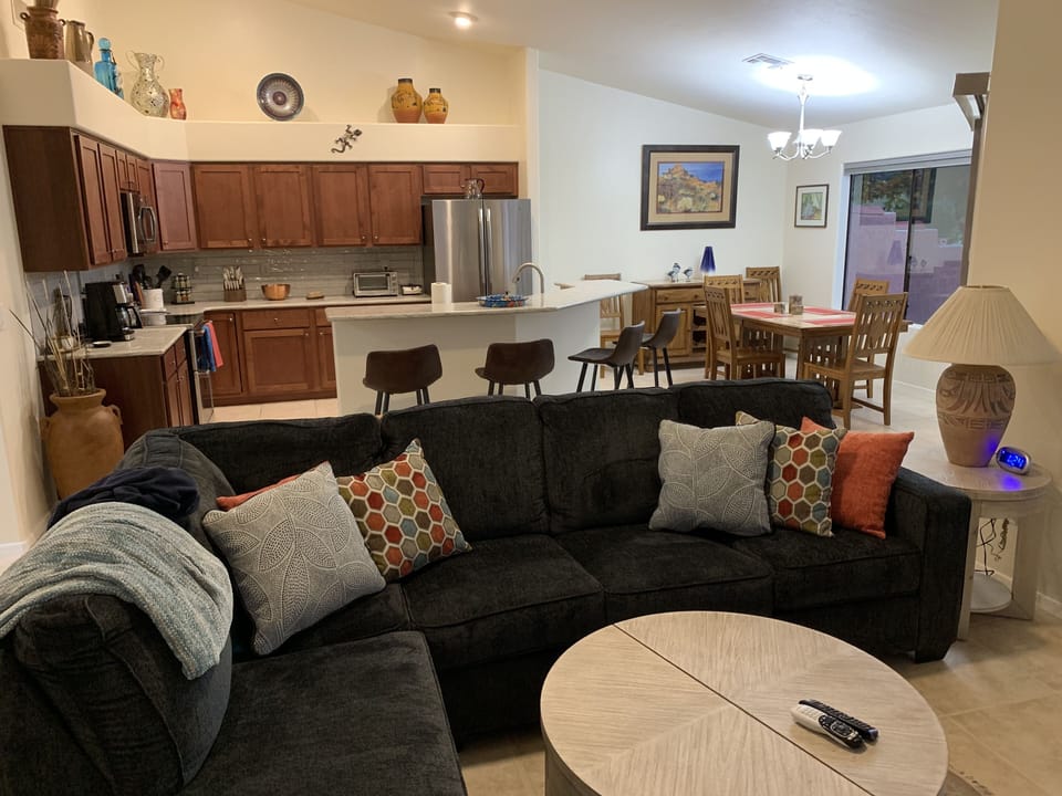 Multiple areas of comfortable seating and open to the kitchen and dining area