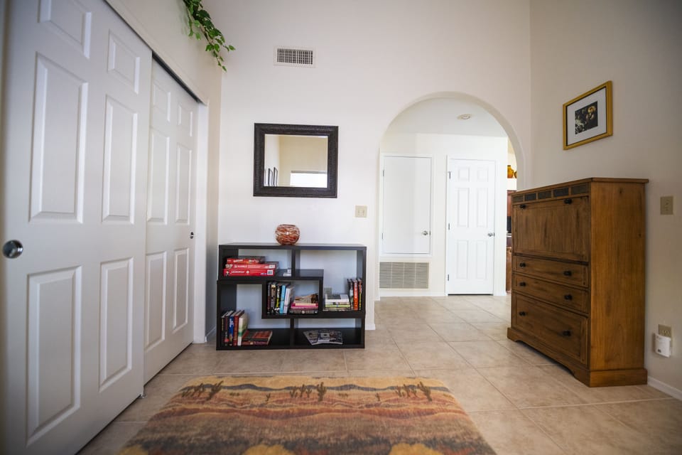 Assortment of games, cards, dice and books, plus a fold down work station.