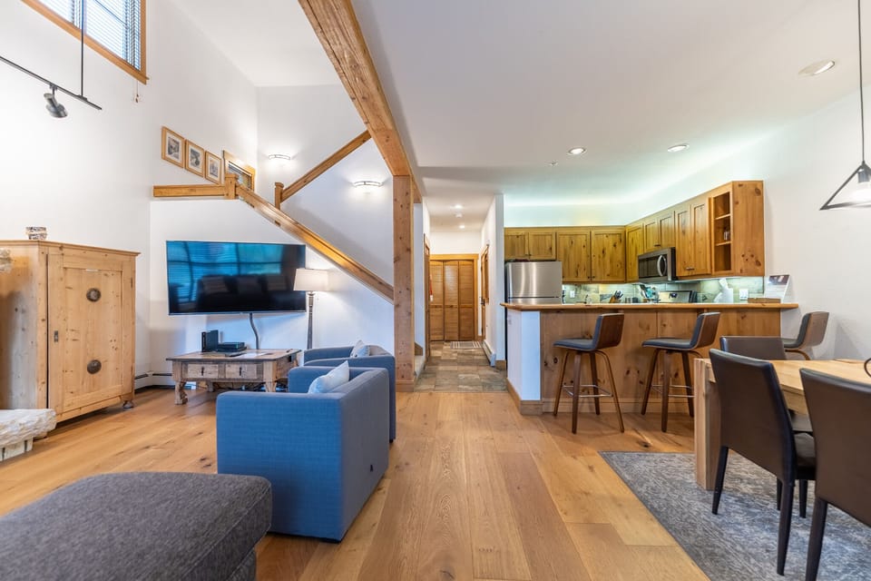 Relax in your bright, open-concept haven where rustic wood beams meet modern comfort—perfect for unwinding after mountain adventures.