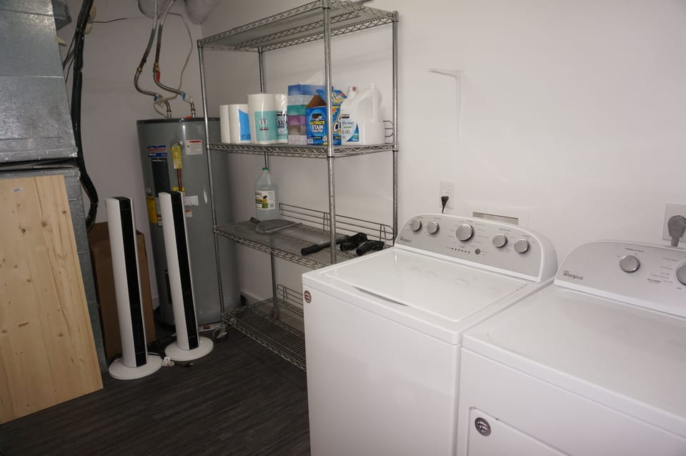 Utility room with extra supplies and a washer/dryer available for your use
