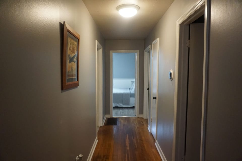 Wide hallway with hardwood floors