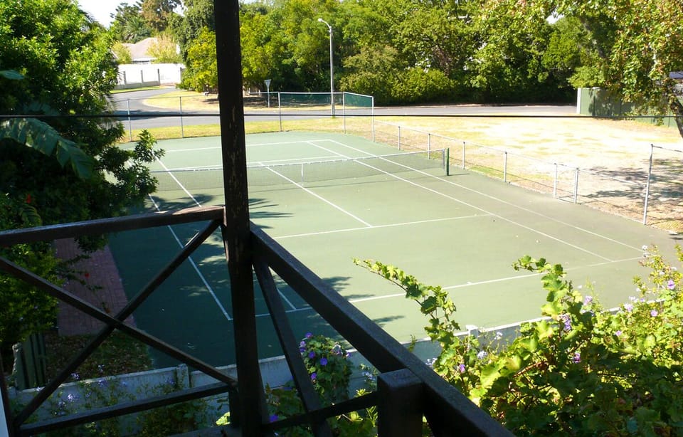 View of our local tennis-pro coach's court, from our South-facing balcony.