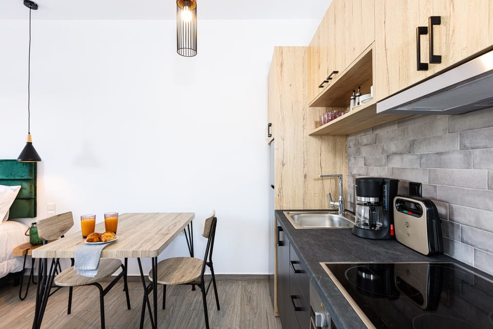 Kitchenette area for culinary creations and dining table. Enjoy your meals.