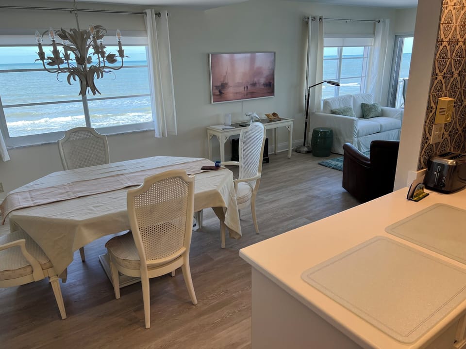 Dining room looking out to the gulf and beaches. Additional Chairs for table