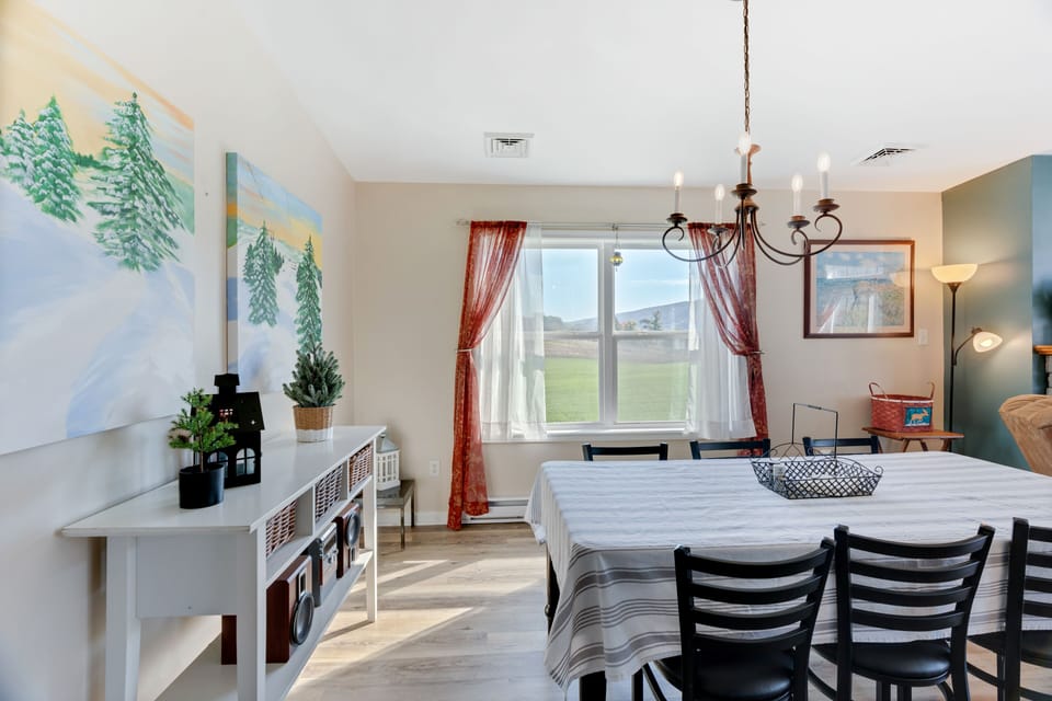 View from kitchen into dining area. Sitting for 6 with extra chairs available. 