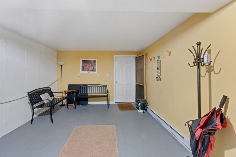 Second basement room, door to outside.  Large enough for folding ping pong table
