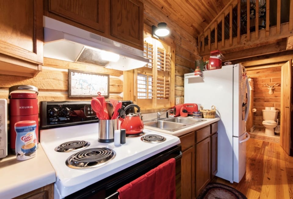 Kitchen has everything you need to cook meals. Plenty of plates and other items