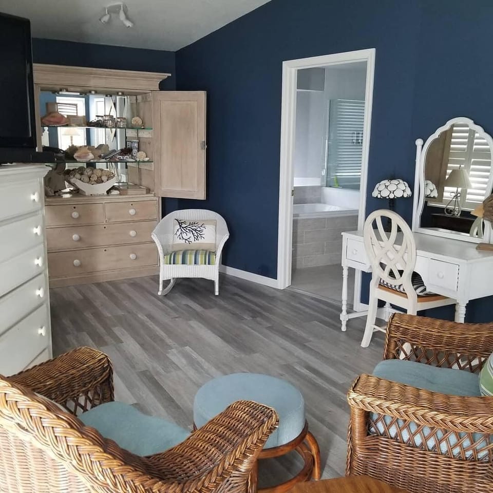 The desk nicely accommodates a laptop and there's a wall outlet with USB ports 