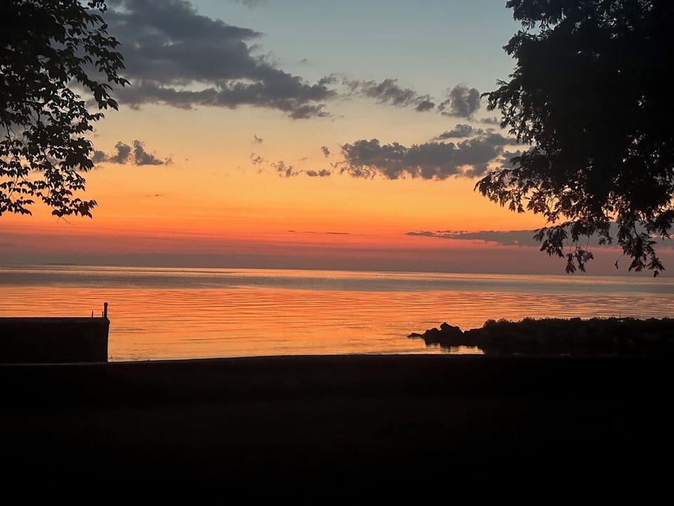 Sunset over private harbor and pier