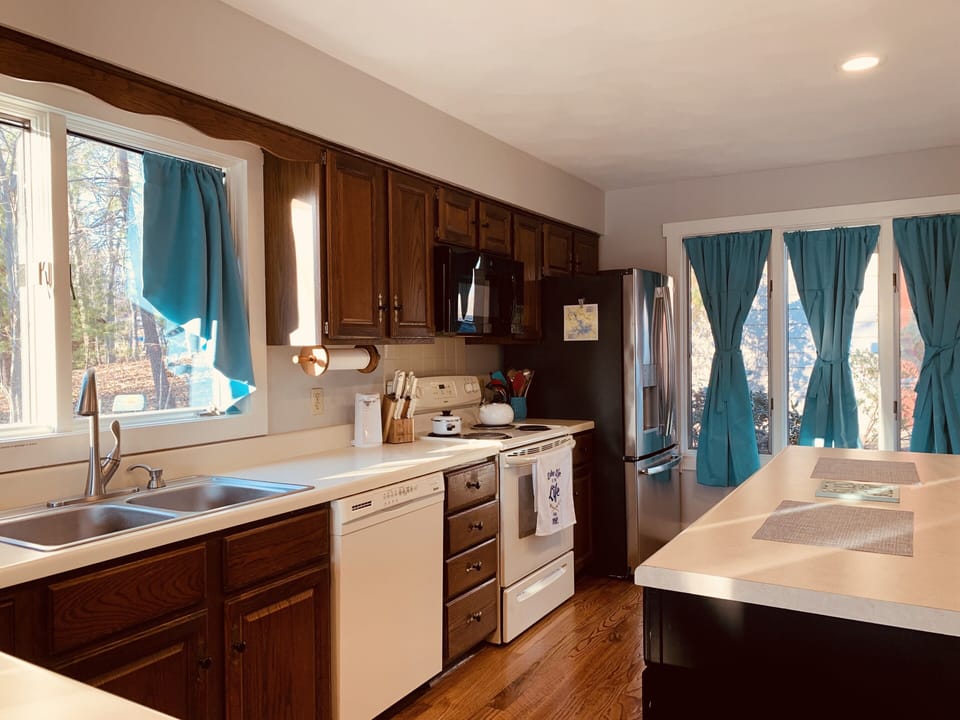 Large kitchen with island, well stocked, plenty of room for multiple cooks!