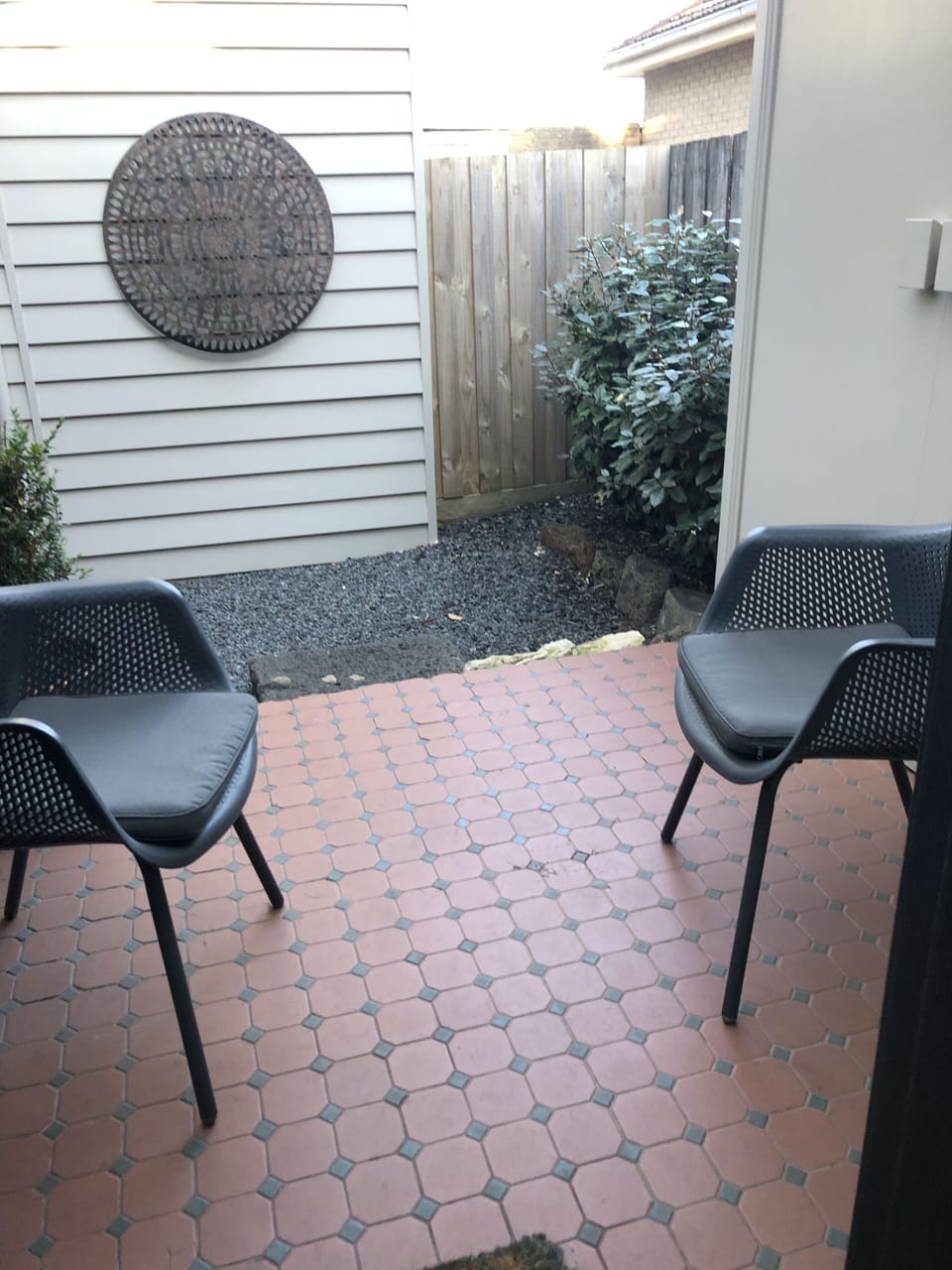 Small enclosed outdoor area with part undercover area.