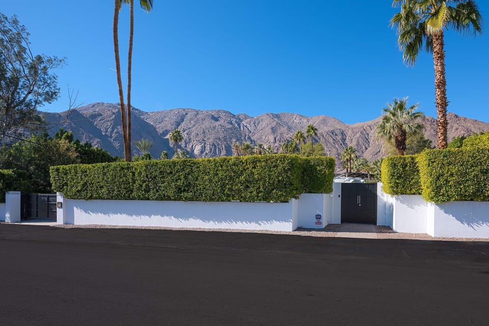 Immerse yourself in the magic of old Hollywood at this meticulously renovated 1957 mid-century modern estate, once the treasured residence of philanthropist Jeannette Edris Rockefeller, in the prestigious Old Las Palmas neighborhood of Palm Springs.