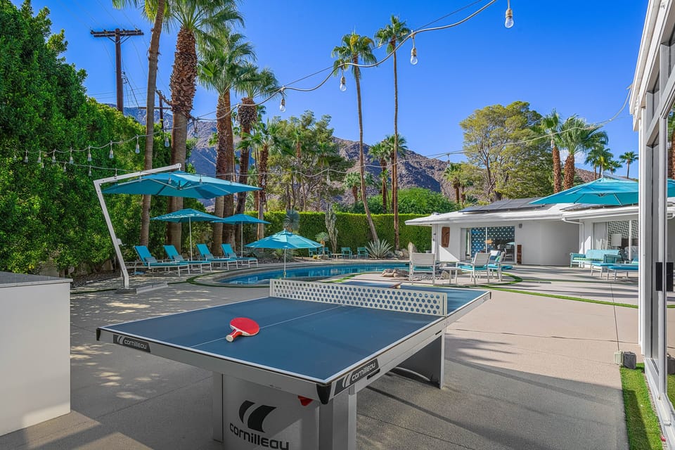 Game on! Step into a sun-drenched paradise, where laughter fills the air as you challenge friends to a thrilling game of pong right by the sparkling pool. Sip refreshing drinks and revel in the carefree vibe of outdoor fun and relaxation! 