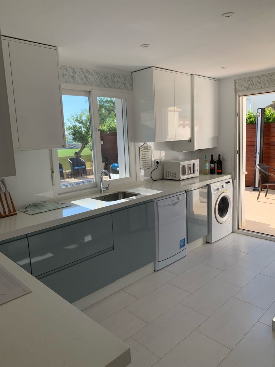 Kitchen overlooks pool and golf course