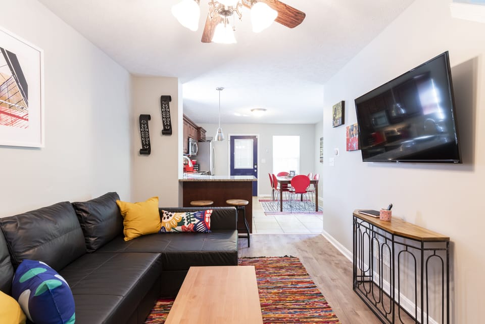 Living room with Smart TV and pull out (queen size) couch.