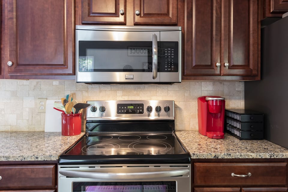 Fully stocked kitchen with pots, pans, and everything you need to cook a meal.