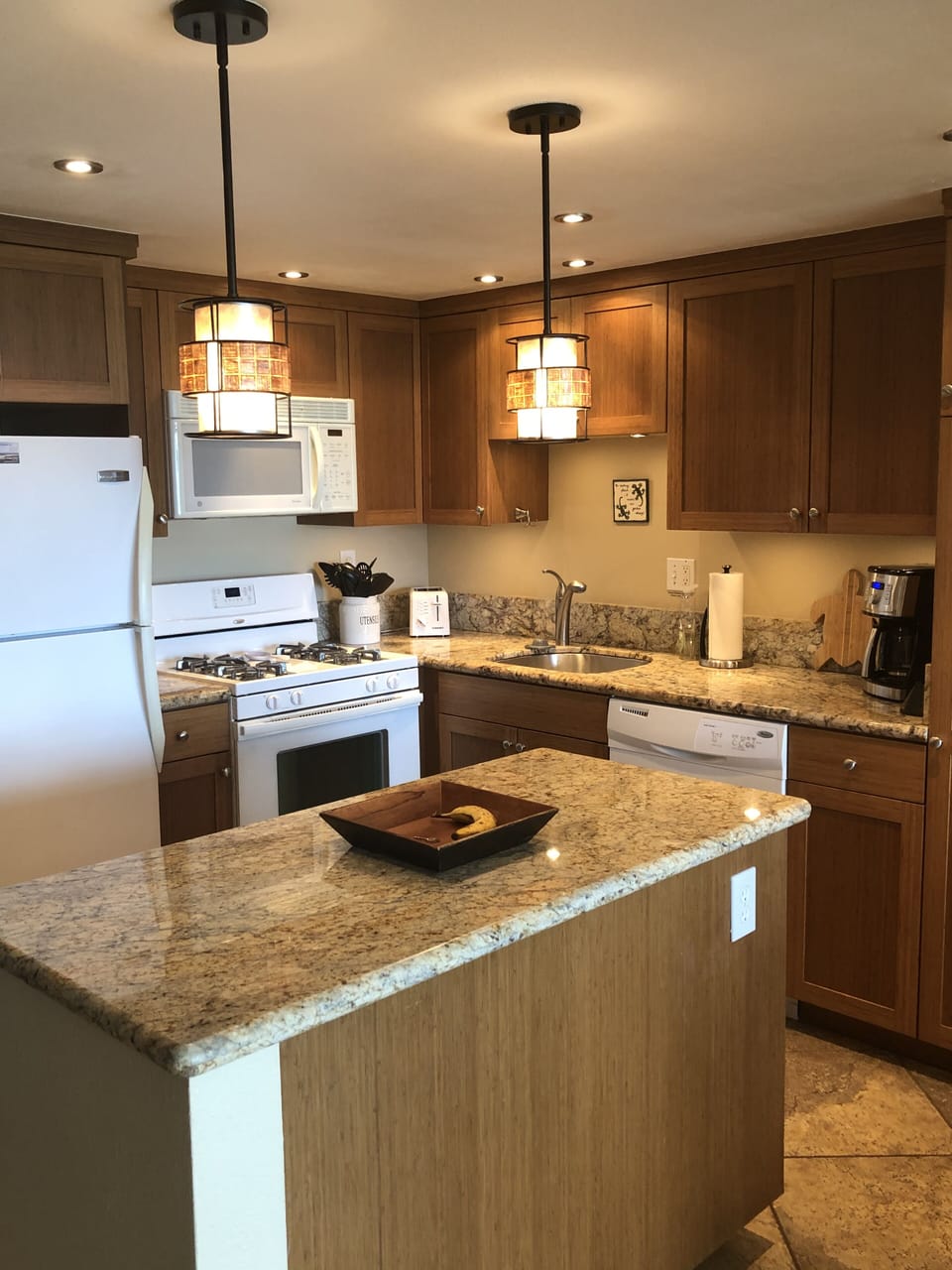 Updated kitchen with granite counters and gas stove