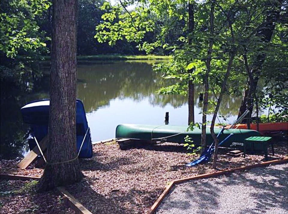 A paddle boat, canoe, paddle board, two kayaks, and 6’x15’ lily pad at the ready