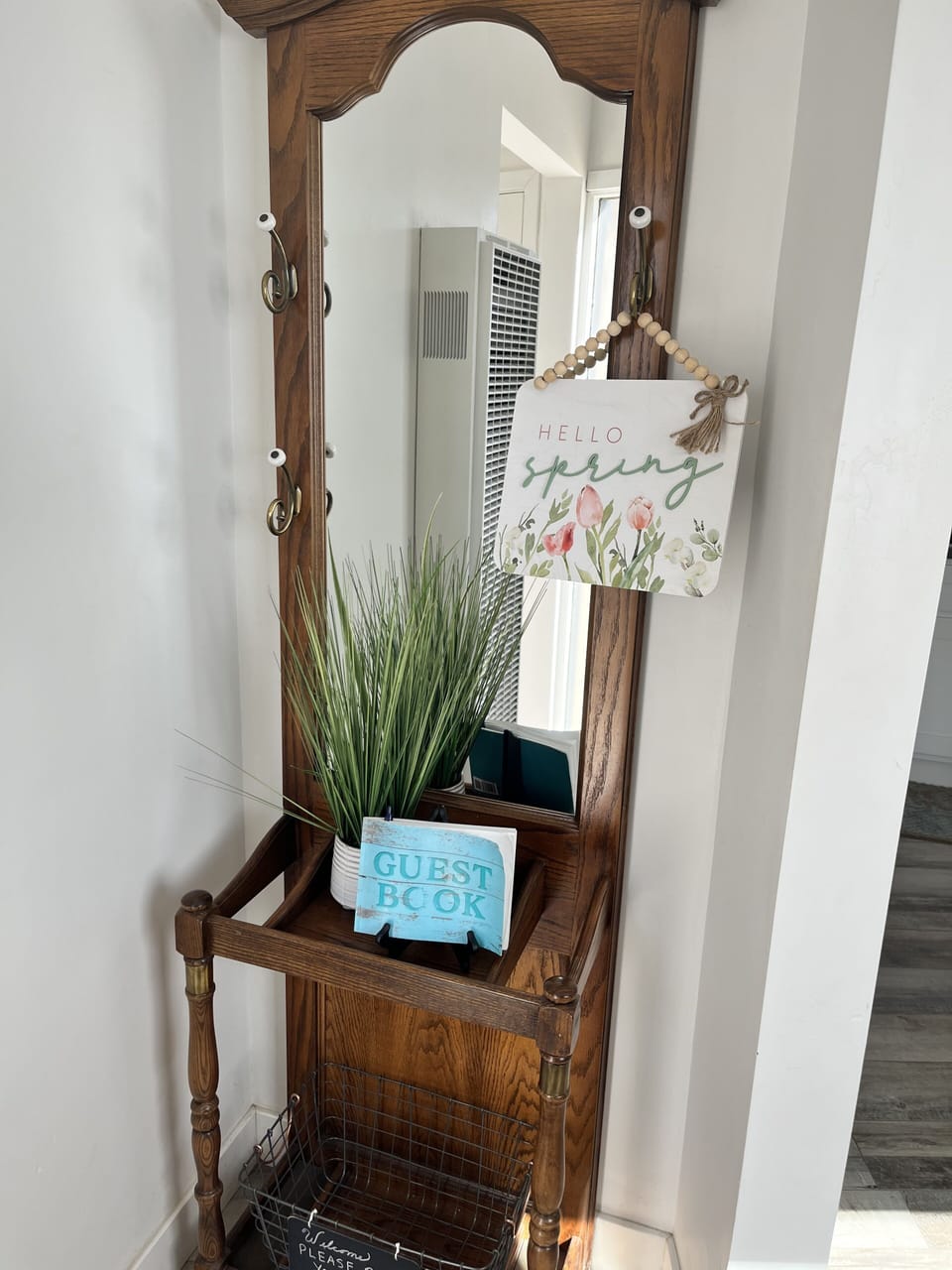Hall tree to hang hats, keys, and courtesy shoe storage below.
