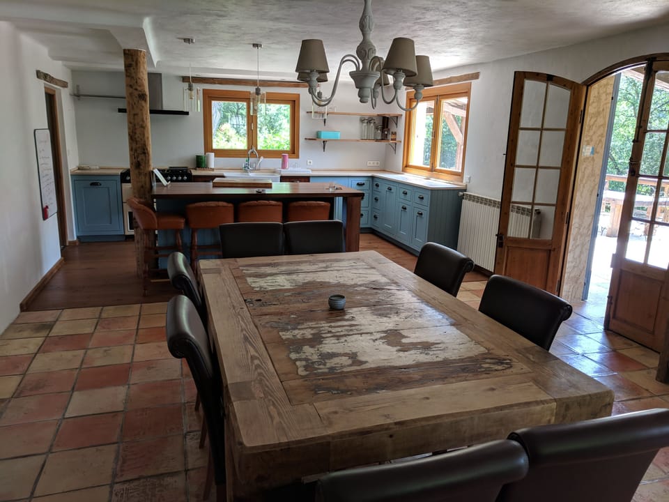 Open plan kitchen and dining areas.