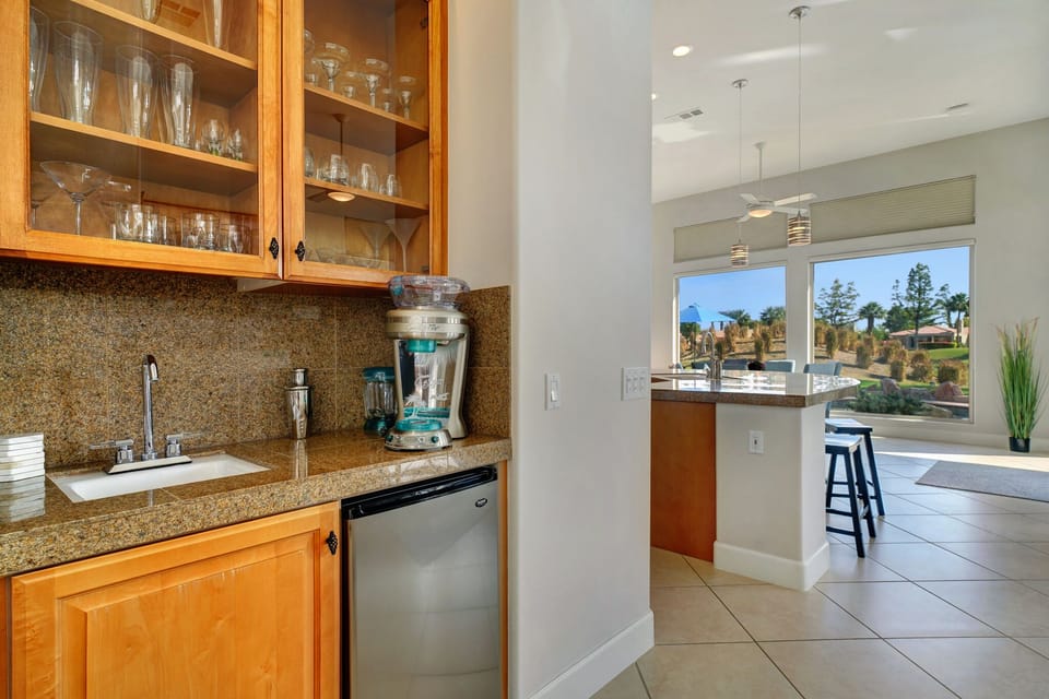 Mini bar area is complete with an assortment of glasswear and Margarita maker!