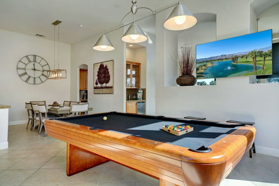 The pool room has a smart tv and a sonos entertainment unit